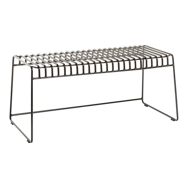 Black metal bench with a geometric, slatted design, featuring a sleek and modern aesthetic.
