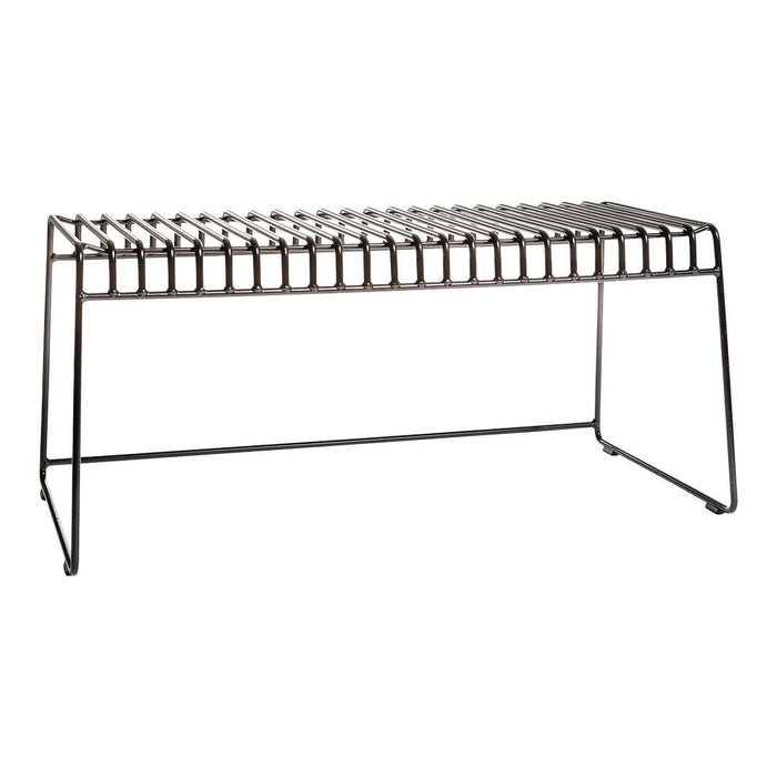 Black metal bench with striped pattern, featuring a sleek, modern design and open slat construction.