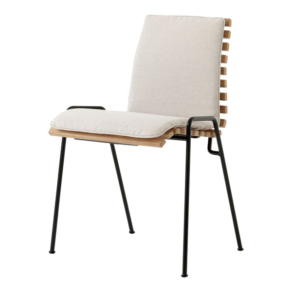 Beige upholstered chair with a natural wood frame and black metal legs, featuring a modern, minimalist design.