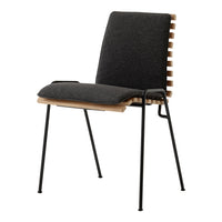 Stylish black upholstered chair with wooden accents and sleek black metal legs. Modern minimalist design.