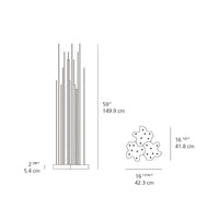 "Modern metal sculpture with sleek silver rods and a playful white flower design base."
