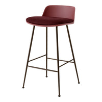 Modern burgundy velvet bar stool with sleek brown metal legs. Minimalist design, perfect for contemporary decor.