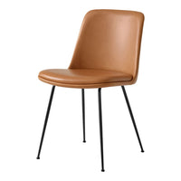 Tan leather chair with smooth surface and black metal legs, featuring a minimalist, modern design.