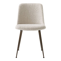 Cream upholstered chair with textured, fluffy fabric and sleek metal legs. Perfect for modern decor.