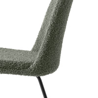 Olive green textured chair with a simple, modern design and black metal legs. Ideal for contemporary interiors.