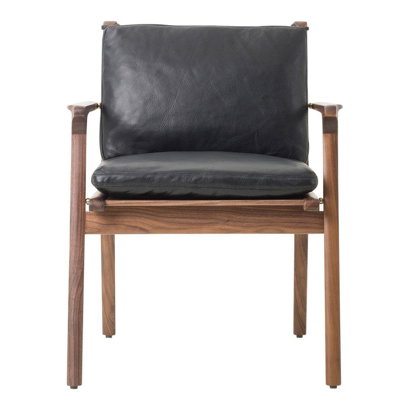 Black leather seat and backrest with walnut wood frame, offering a sleek, modern aesthetic. Ideal for contemporary spaces.
