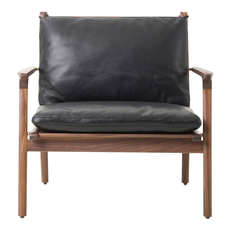 Modern black leather loveseat with a warm walnut wood frame, featuring a sleek, minimalist design.
