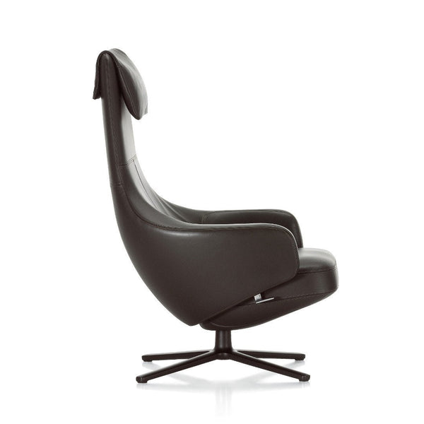 Sleek black leather accent chair featuring a modern design and smooth, curved lines. Perfect for contemporary decor.
