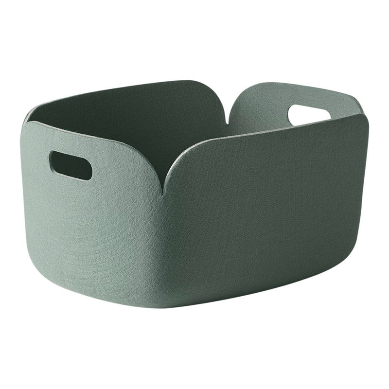 Green storage basket with a smooth texture and minimalist design, featuring curved edges and convenient handles.