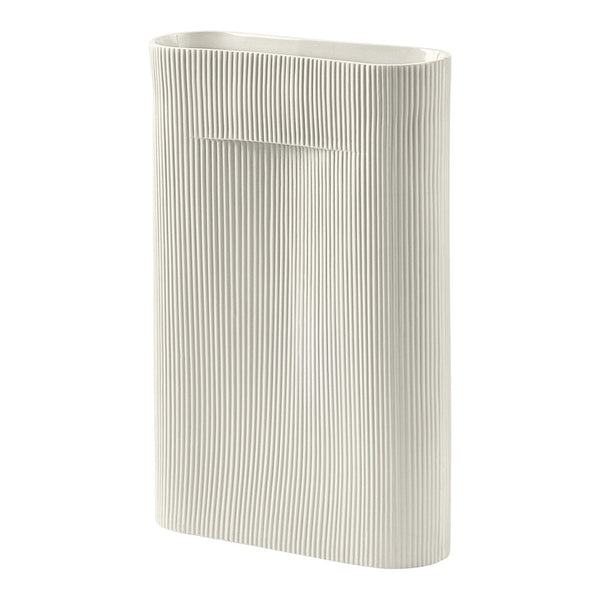 White ceramic vase with vertical ridges, featuring a minimalist design and subtle texture. Perfect for modern decor.