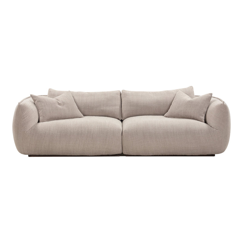Beige, textured fabric sofa with soft, rounded edges and matching throw pillows. Perfect for modern living spaces.