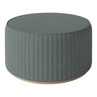 Round, ribbed ottoman in soft teal fabric with a light wood base, adding elegance to any space.