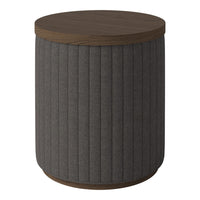 Gray ribbed fabric cylindrical side table with a dark wood top and base. Modern and stylish accent piece.