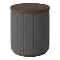 Gray ribbed fabric accent table with a dark wood top and base, combining modern textures and earthy tones.