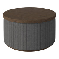 Round coffee table with a dark wood top and gray ribbed fabric base, showcasing a sleek, modern design.