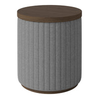 Gray ribbed fabric side table with a round dark wood top and curved base.