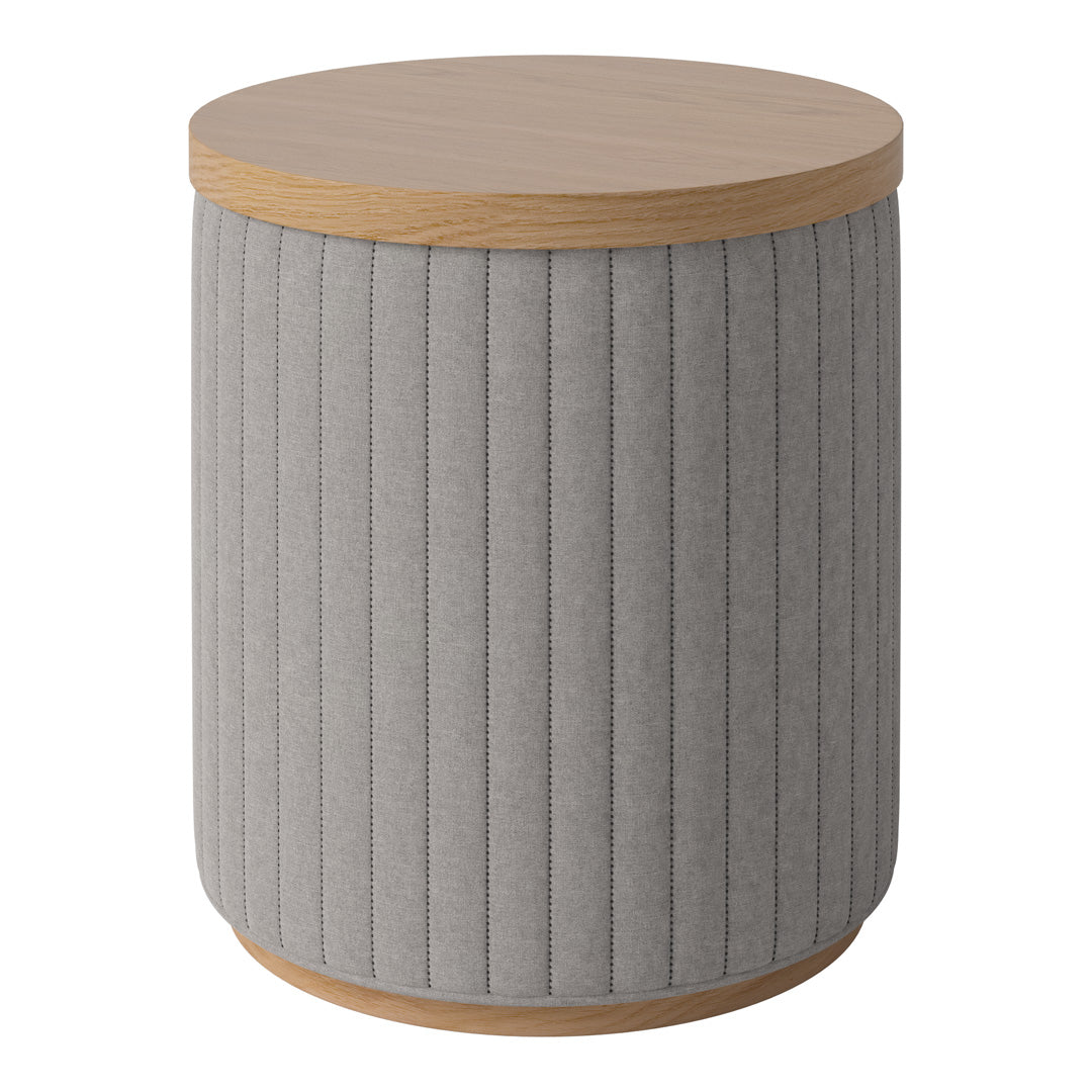 Round gray upholstered table with vertical ribbed texture and a natural wood top. Ideal for modern decor.