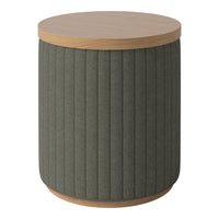 Round side table with a textured dark green fabric body and a light wood top, featuring vertical ribbed patterns.