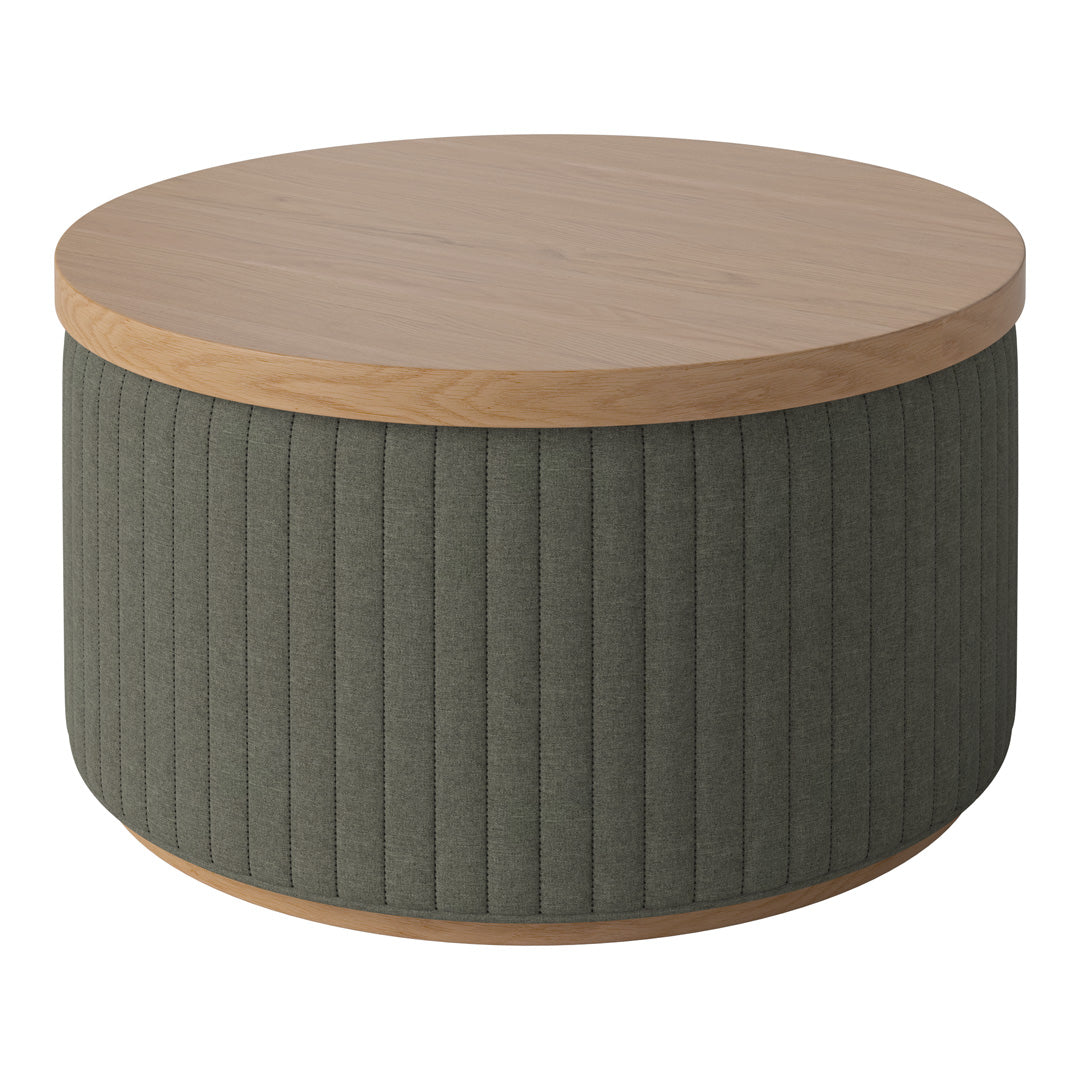 Round coffee table featuring a natural wood top and green ribbed fabric base, adding a modern touch to any space.