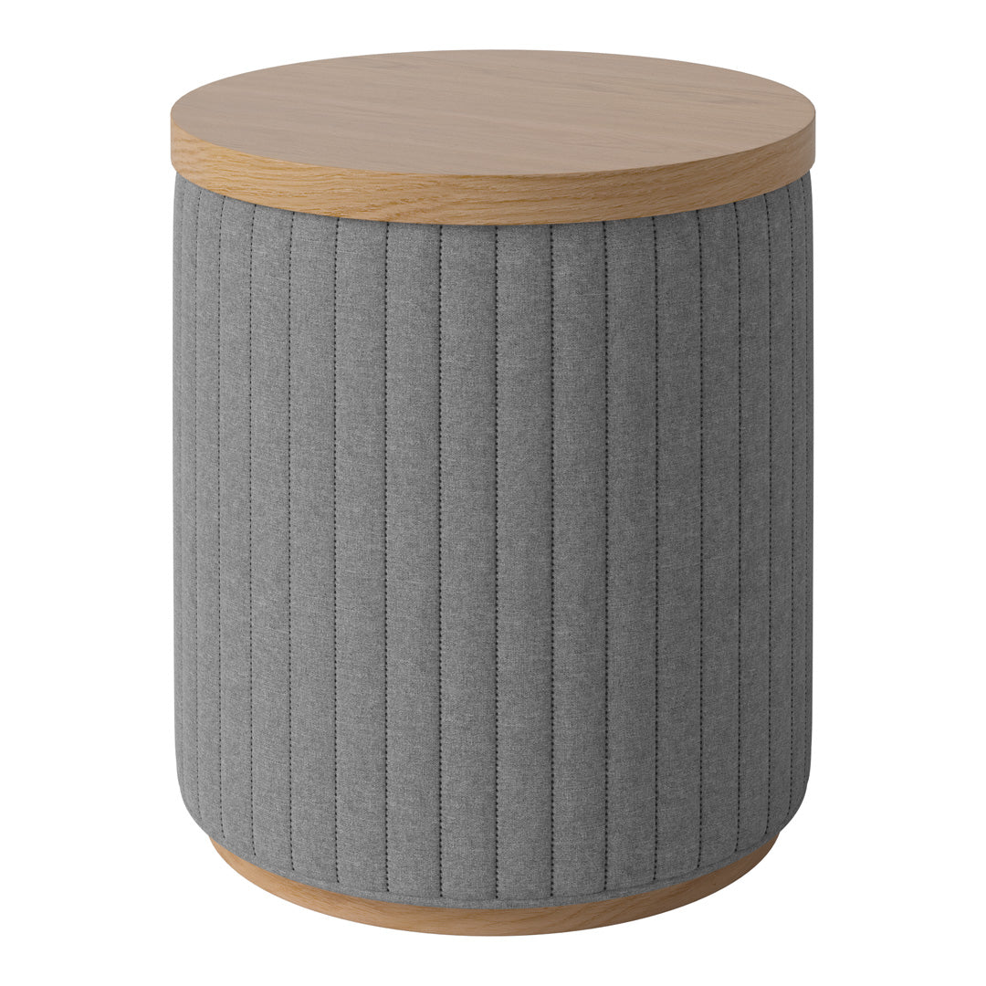 Gray vertical ribbed fabric drum accent table with a light wooden top. Stylish and modern design for any space.