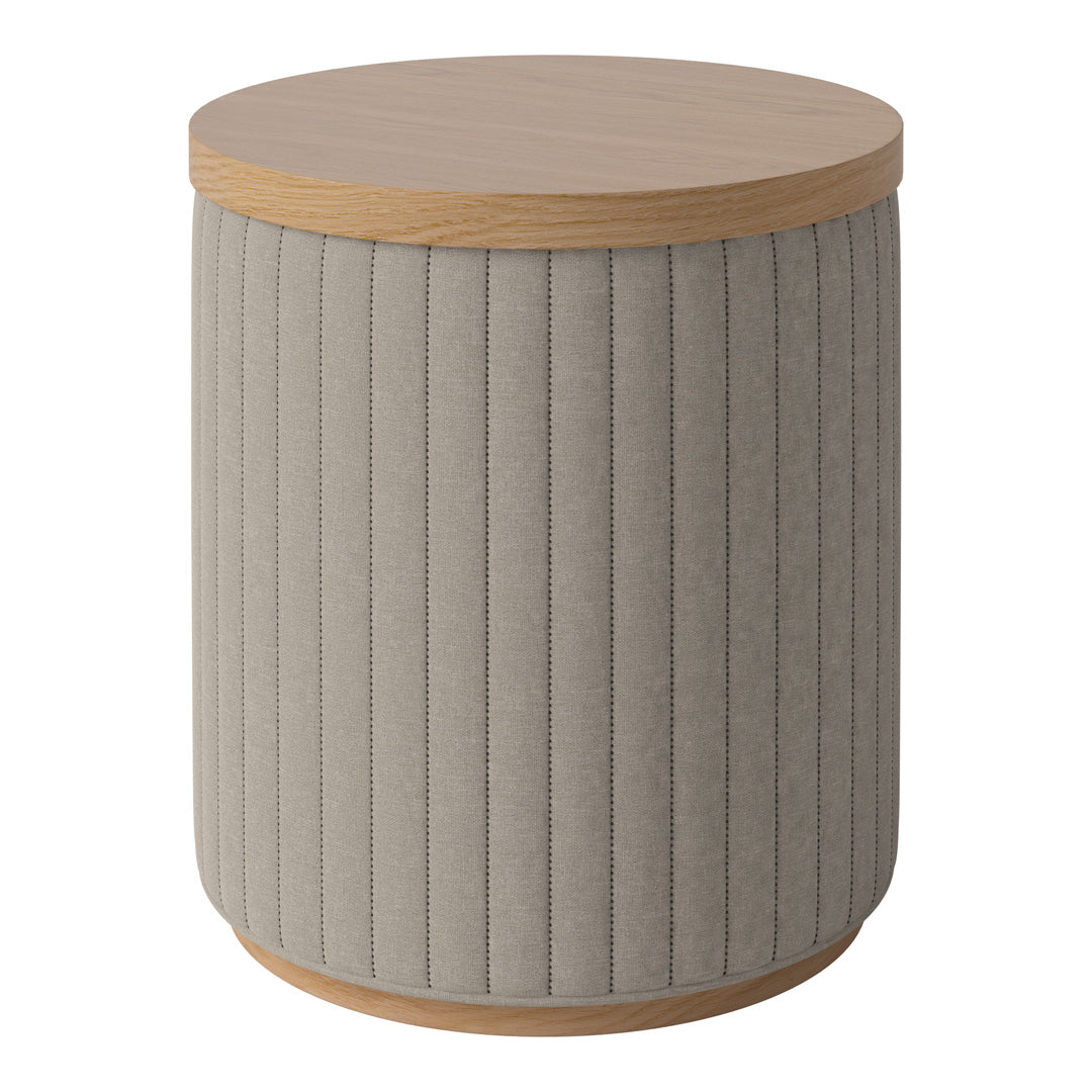 Grey upholstered round side table with vertical ribbed pattern and a natural wood top. Stylish accent piece for any room.