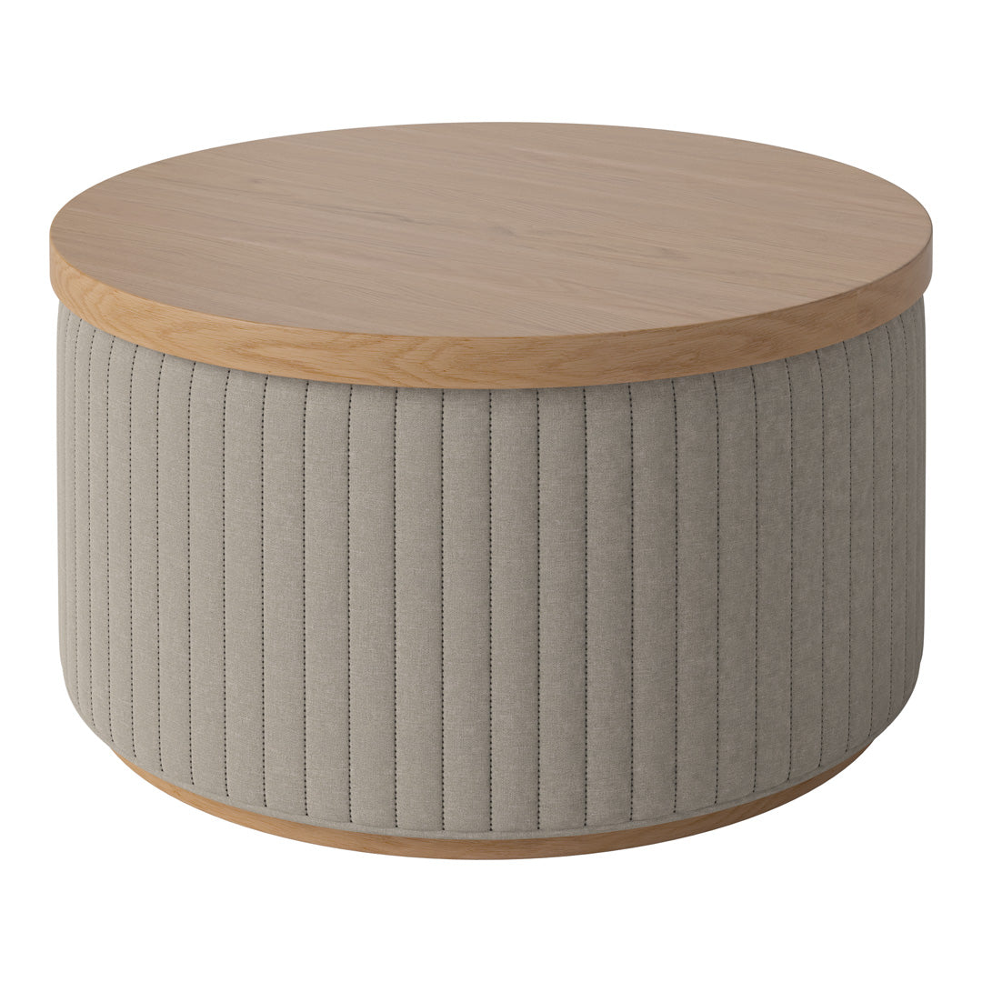 Round coffee table with a light wood top and textured beige fabric base featuring vertical ribbed patterns.
