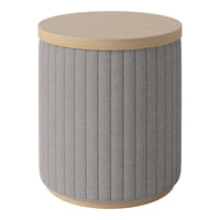 Gray upholstered round side table with vertical ribbed pattern and light wood top. Ideal for modern decor.