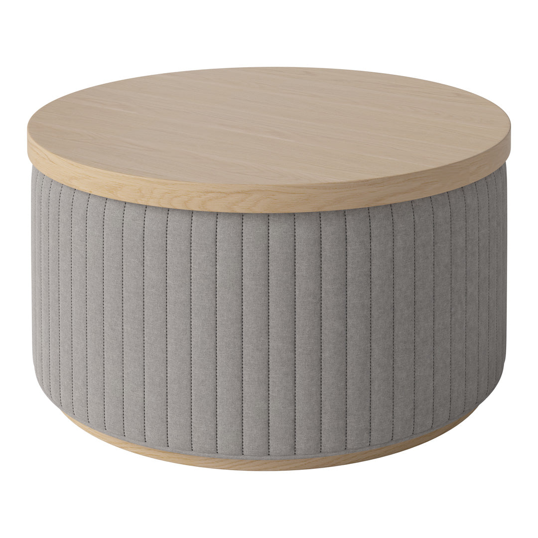 Round coffee table with a natural wood top and soft gray ribbed fabric sides for a modern, textured look.