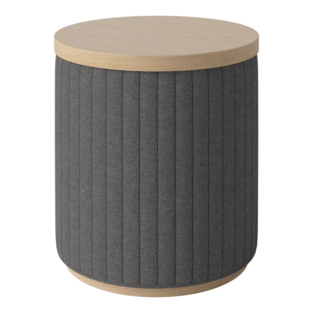 Round side table with a grey upholstered body and light wood top, featuring vertical ribbed patterns for texture.