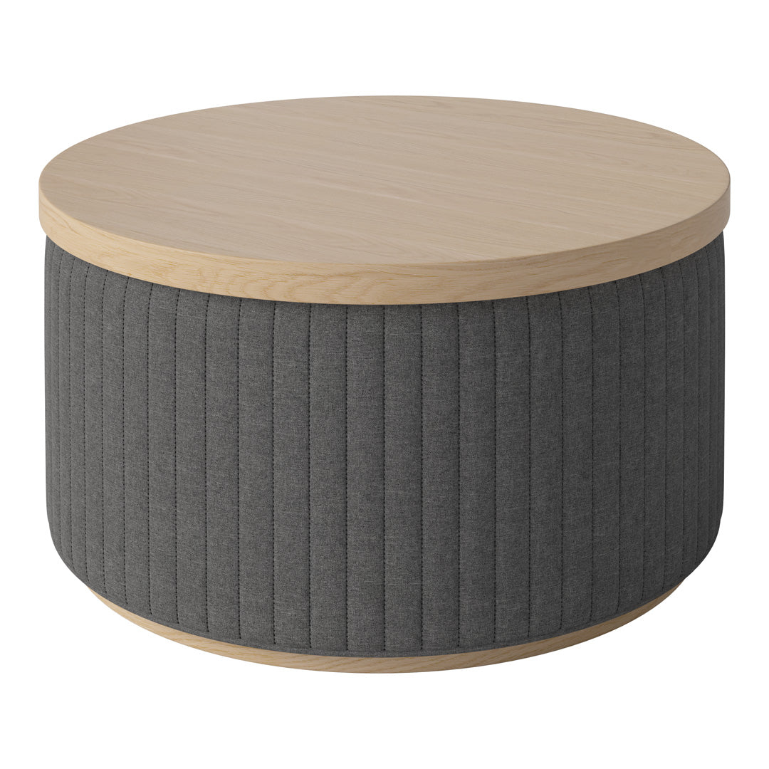 Round coffee table with a natural wood top and textured dark gray fabric side. Features vertical ribbed pattern.