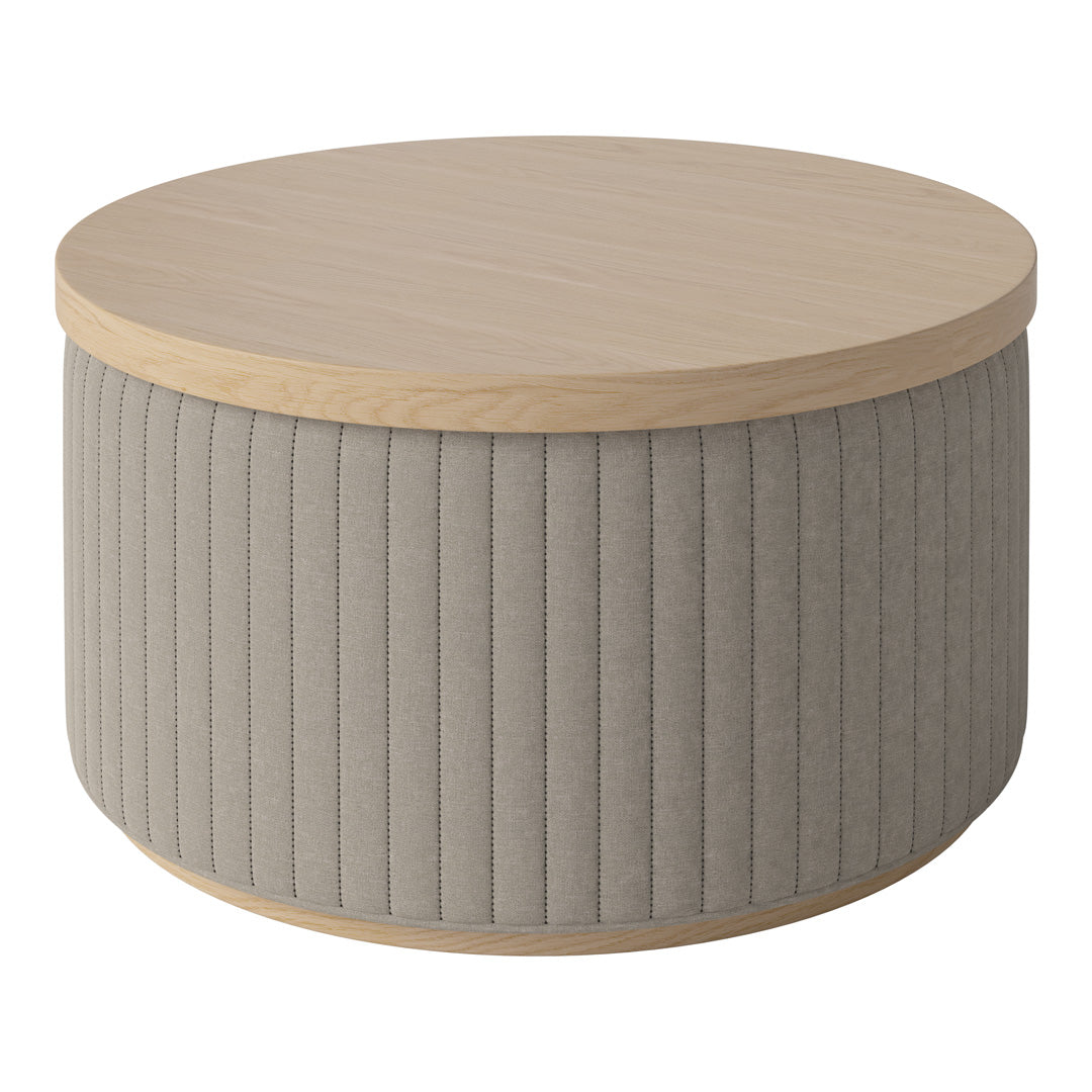 Round coffee table with light wood top and textured beige fabric base featuring vertical ribbed pattern.