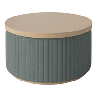 Round coffee table with a light wood top and textured gray fabric sides featuring vertical ribbed patterns.