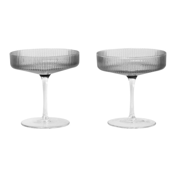 Set of two elegant gray coupe glasses with a ribbed pattern, featuring clear stems and bowls. Perfect for stylish dining.