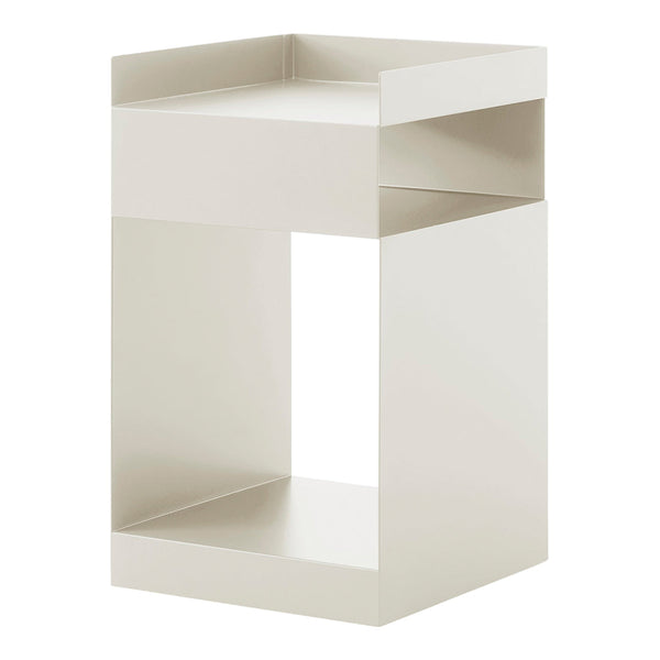 Minimalist white storage stool with a sleek, geometric design and smooth, matte finish, perfect for modern interiors.