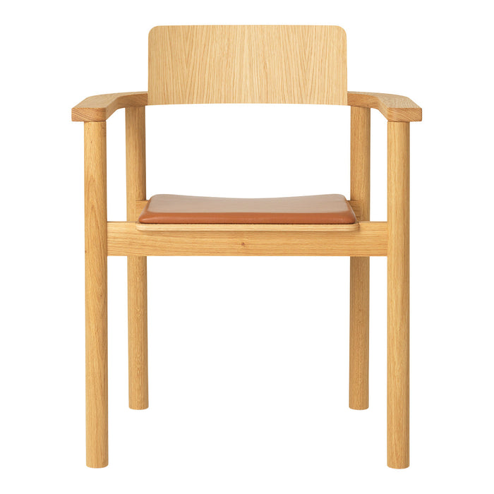 Natural wood chair with light oak finish and a tan leather seat, featuring a simple, modern design.