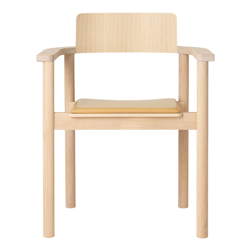Light wood chair with natural finish, featuring a minimalist design and a smooth, solid seat.