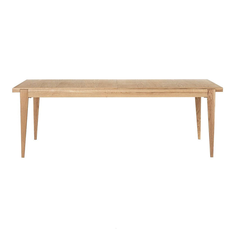 Natural wood dining table with light beige finish and smooth, minimalist design. Simple, elegant, and timeless look.