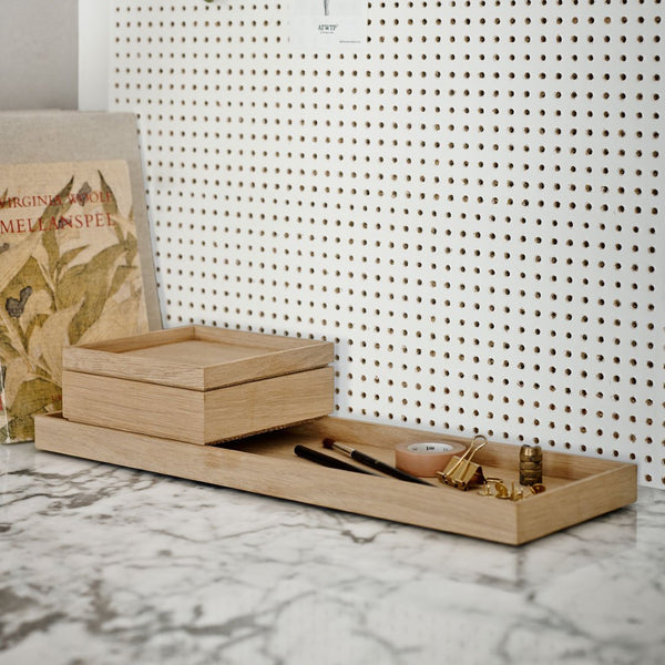 Natural wood tray set with light beige tones and smooth surfaces, featuring geometric shapes and minimalistic design.