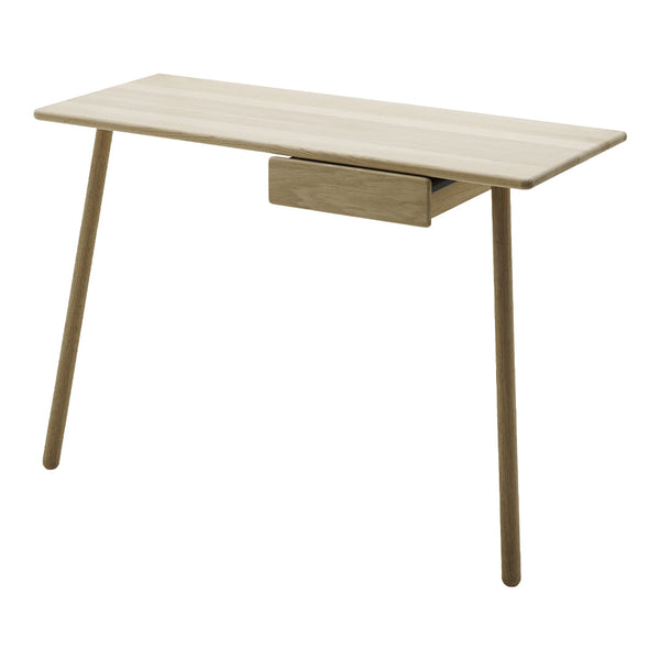 Light oak desk with a minimalist design, featuring a smooth surface and tapered legs in natural wood tones.