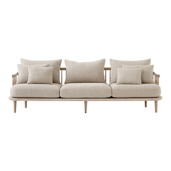 Neutral beige sofa with a smooth fabric finish, featuring simple, plush pillows for added comfort and style.
