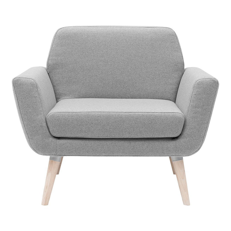 Gray upholstered armchair with light wooden legs, featuring a minimalist design and soft, smooth fabric.