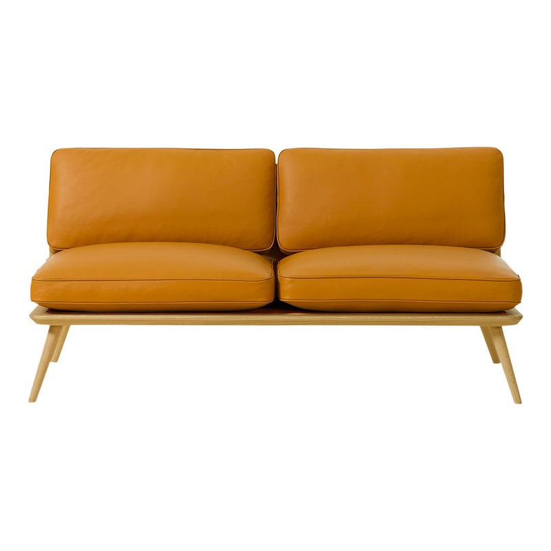 Orange leather sofa with sleek lines and natural wood legs, perfect for modern decor.
