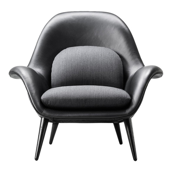 Black leather chair with gray fabric cushion, featuring smooth curves and sleek black legs. Elegant modern design.
