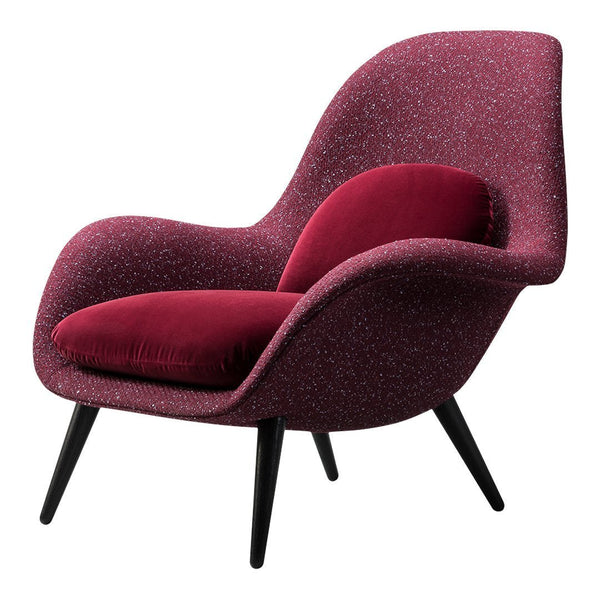 Plush burgundy chair with textured fabric featuring a modern silhouette and classic black legs. Ideal for stylish interiors.
