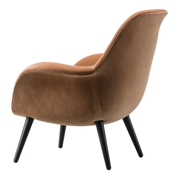 Brown velvet accent chair with sleek black legs, featuring a smooth, curved design and minimalist style.