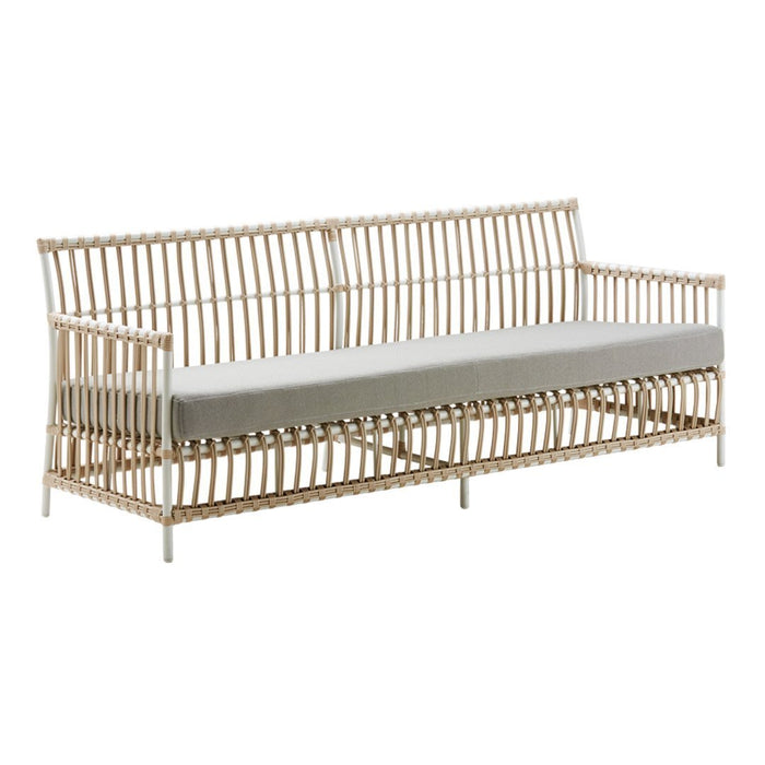 Natural rattan sofa with sleek beige cushions, showcasing a minimalist, striped pattern. Perfect for modern decor.
