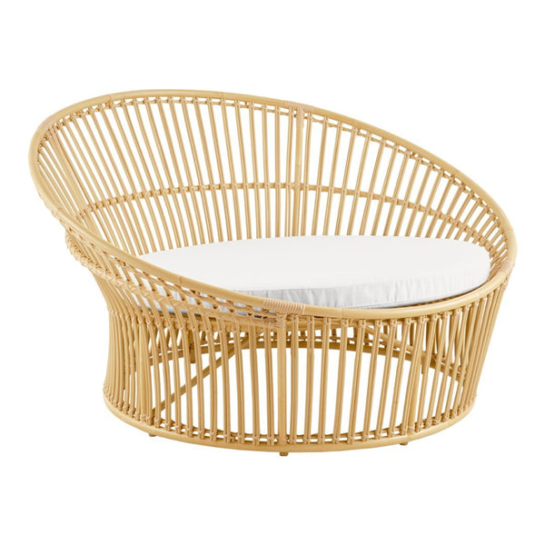 Natural rattan chair with a curved design, featuring a white cushion for a fresh, modern look.