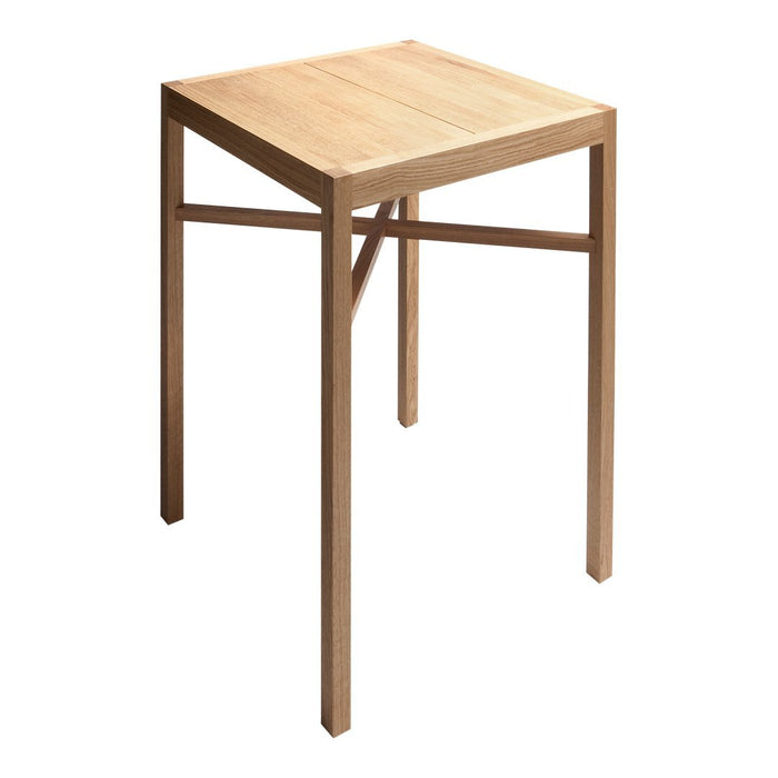 Natural light wood square table with simple, sleek design and no visible patterns. Ideal for minimalistic decor.