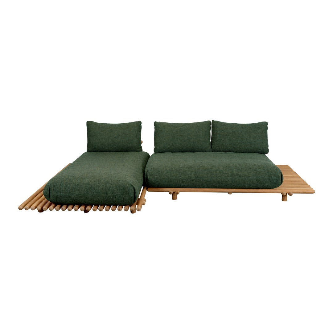 Dark green cushions on a wooden platform, featuring a sleek, minimalist design and natural wood accents.