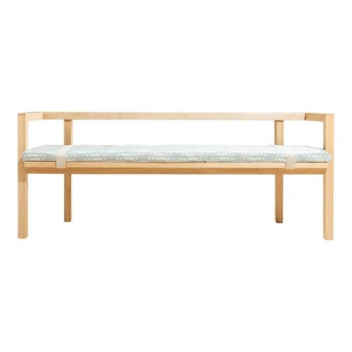 Natural wood bench with a light blue and white patterned cushion. Modern design with clean lines and minimalistic style.